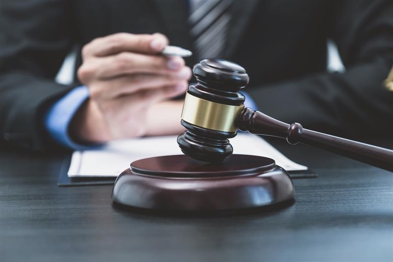 lawyer gavel and folding hands