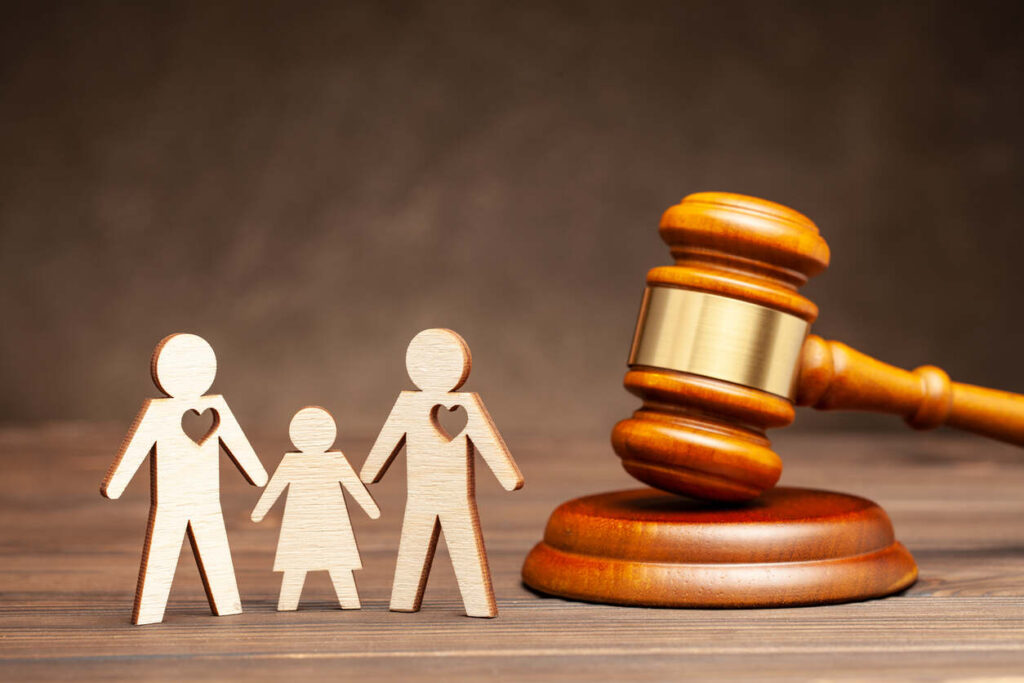 lawyer gavel and wife, hushband and child statue 