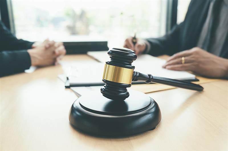 lawyer discussing cases and gavel on the table