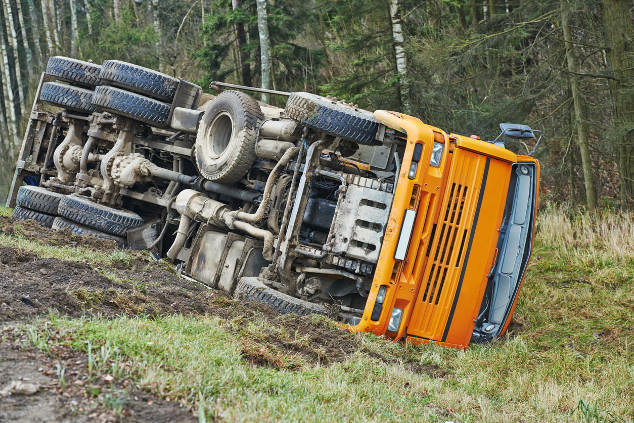 Overturned orange truck in Williams Twp., MO, on US-65 after crash involving Lawrence Harms.