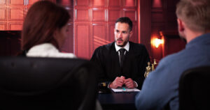 Divorce lawyer consulting with clients in courtroom, discussing legal matters and divorce proceedings