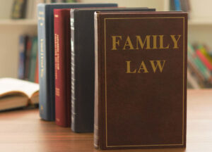 Close-up of family law books on a desk, symbolizing expertise and legal services provided by Martin Law Office in family law matters.