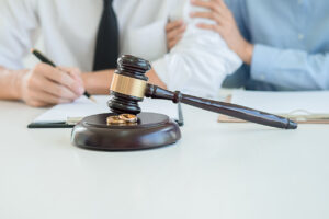 Divorce mediation with legal gavel and wedding rings, symbolizing jurisdictional issues in divorce proceedings