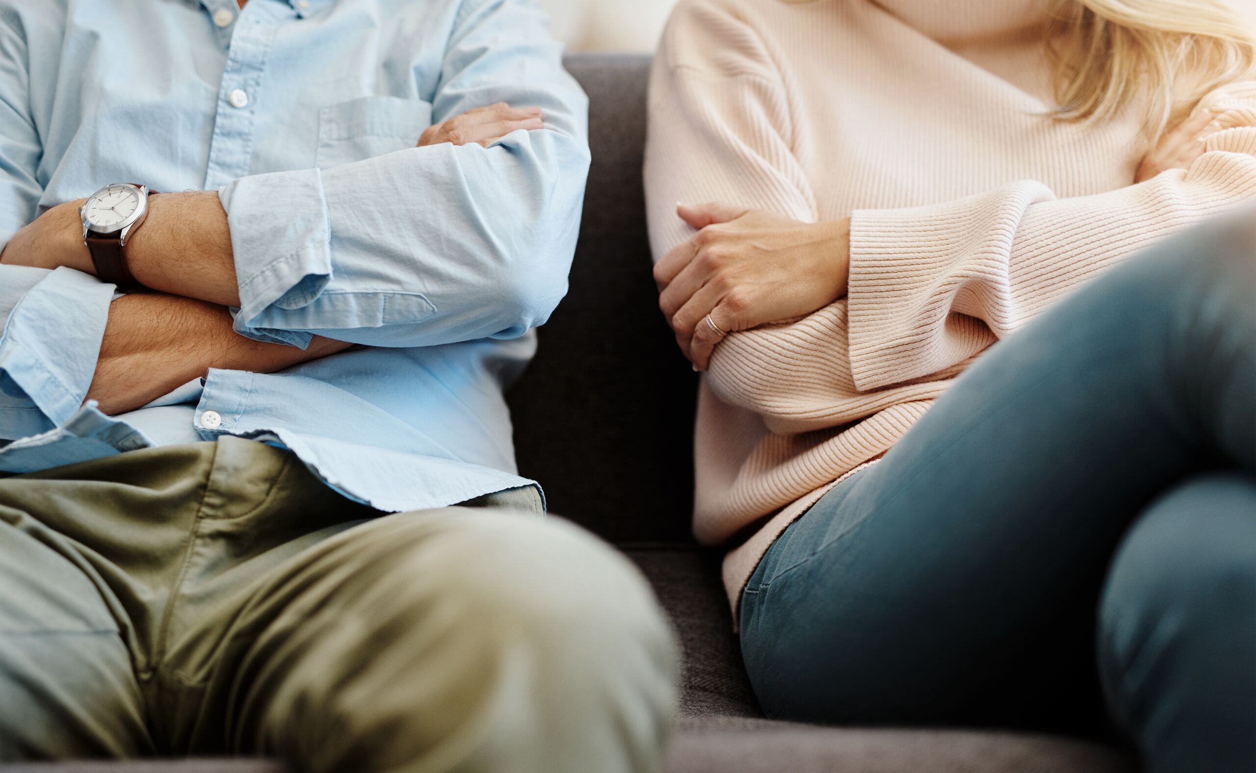 Couple sitting apart during a consultation with an uncontested divorce attorney in Kansas.
