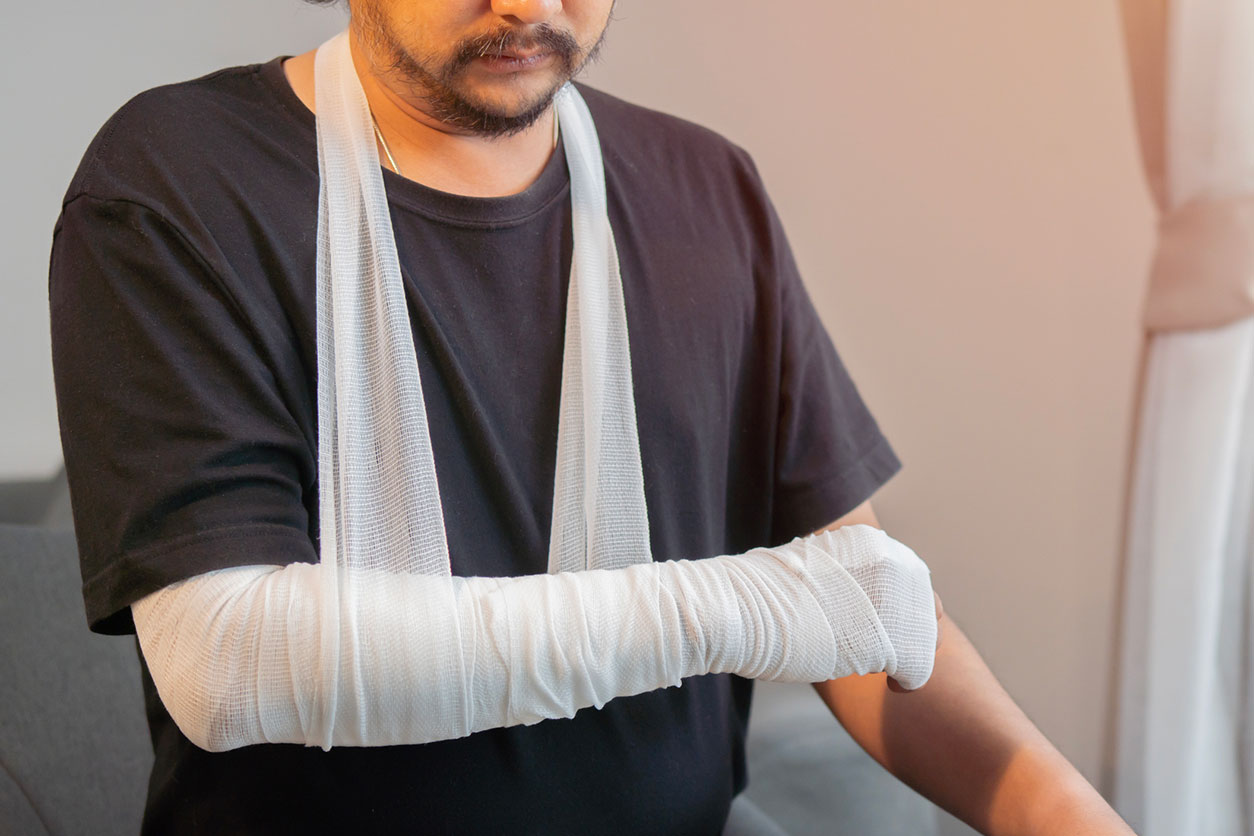 Injured person with a bandaged arm concept image, representing Kansas personal injury claims after a serious accident and recovery needs